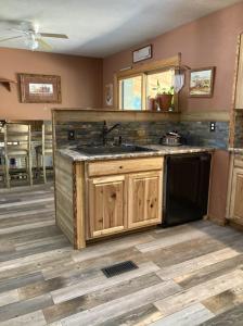 a kitchen with a sink and a stove at Spacious home away from home! in Pueblo