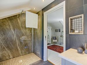 a bathroom with a walk in shower next to a door at 2 Bed in Wincle PK928 in Allgreave +37 photos