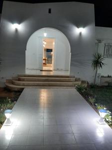 a house with a patio with lights on it at Villa Narjess in Taguermess