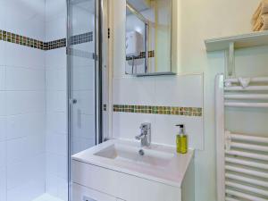 a white bathroom with a sink and a shower at 2 Bed in Tregaron 43293 in Tregaron +24 photos