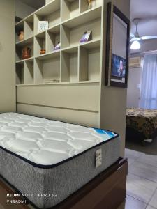 a room with a mattress and a tv in a room at Alquiler Temporario Tucumán Con Cochera Y Pileta in San Miguel de Tucumán
