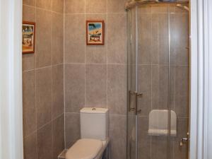 a bathroom with a toilet and a shower at 2 Bed in Bridport 88614 in Chideock