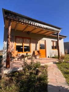 a patio of a house with a wooden pergola at Ranchos de la Tata in Las Calles