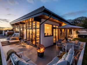 a house with a patio with a fire pit at 3 Bed in Portreath 90550 in Camborne