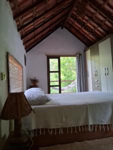 Postel nebo postele na pokoji v ubytování Casa do Bosque