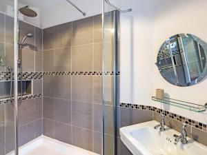 a bathroom with a shower and a sink at 4 Bed in Conwy 50934 in Tal-y-Cafn +54 photos