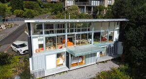 an aerial view of a house with people in it at Hosts on the Coast Paku Paradise in Tairua
