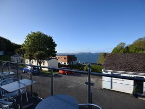 a balcony with a view of a parking lot at 2 Bed in Brixham BX054 in Brixham