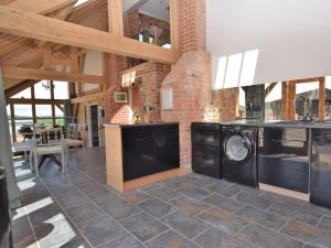 a kitchen with a washer and dryer in a building at 2 Bed in Dorchester 41364 in Ansty