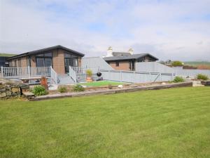 a house with a lawn in front of it at 2 Bed in Auchenmalg 79129 in Gillespie