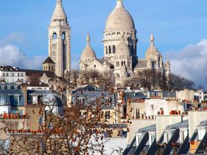 a view of a city with towers in the background at ibis budget Paris Porte De Montmartre in Paris