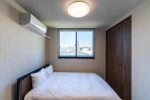 Postel nebo postele na pokoji v ubytování Flower Base TSUBAKI - Vacation STAY 59155v + 47 fotografií