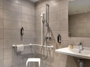 a bathroom with a shower and a sink at Hotel Ibis Budget Montpellier Centre Millenaire - in Montpellier +53 photos