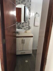 a bathroom with a sink and a mirror at Casa Hotel Alborada in San Antero +13 photos