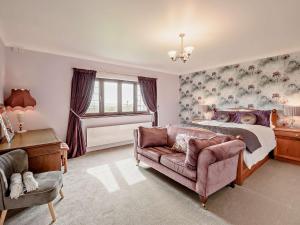 a bedroom with a bed and a couch at 6 Bed in Clovelly 1.5mls S 91361 in Clovelly +100 photos