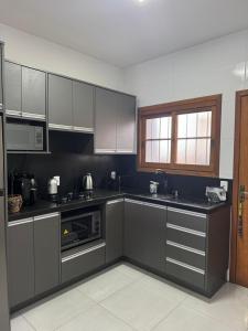 Køkken eller tekøkken på Casa na praia de Capão da Canoa + 12 billeder