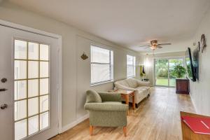 a living room with a couch and a chair at 3 Mi to Beach and Boardwalk Riverfront Daytona Home in Holly Hill