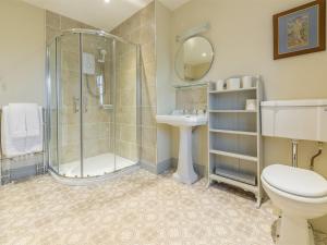 a bathroom with a shower and a toilet and a sink at 2 Bed in Ingoldisthorpe KT074 in Ingoldisthorpe +15 photos