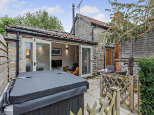a house with a grill in the yard at 1 Bed in Curry Rivel 41489 in Curry Rivel