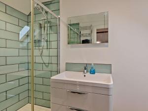 a bathroom with a sink and a shower at 1 Bed in Curry Rivel 41489 in Curry Rivel +21 photos