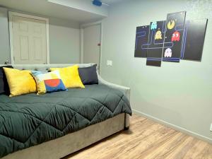a bedroom with a bed with yellow and blue pillows at Endless Summer, Pool, Theatre, Boat Parking, Walk to London Bridge! in Lake Havasu City +26 photos