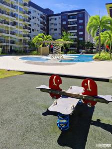 a pair of skateboards sitting on the ground near a pool at Warm Urban Studio with modern design in Molo