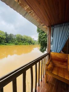 a view of a river from the balcony of a boat at Cat Tien Nature Hotel in Cat Tien +7 photos