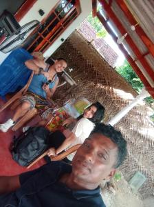 a group of people sitting in a tent at Leeostar Homestay & Safari in Horuwila +2 photos