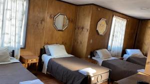 Una cama o camas en una habitación de Hotel de la Costa