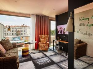 a living room with a view of a building at Mama Shelter Lyon in Lyon