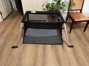 a black and grey table with a chair and a plant at Rooms in an Epsom House in Auckland +7 photos
