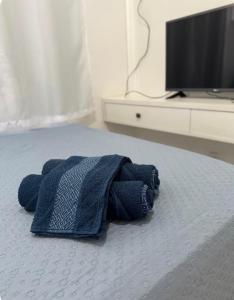 Una televisión o centro de entretenimiento en Apartamento Completo 2 fotos más