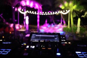 a view of a stage with purple lights at Wyndham Garden Grandworld Phu Quoc in Phú Quốc +68 photos