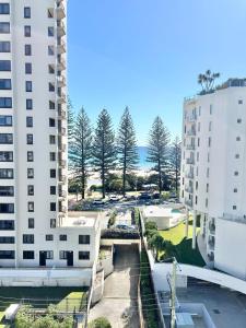 a view of a street between two buildings at Luxury Coolangatta Sub-Penthouse Beach Abode in Gold Coast