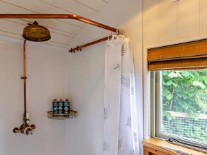 a room with a window and a window curtain at 1 Bed in Salwayash 95502 in Netherbury