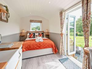 a bedroom with a bed and a large window at 1 Bed in Patterdale 96153 in Patterdale