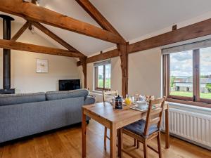 a living room with a table and a couch at 1 Bed in Ludlow 94661 in Letton