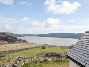 a view of a lake from a house at 1 Bed in Kinlochbervie 86897 in Rhiconich