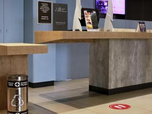 a counter in a store with a trash can under it at ibis Osasco in Osasco