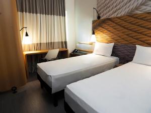 Postel nebo postele na pokoji v ubytování ibis Osasco