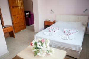Postel nebo postele na pokoji v ubytování Metin Hotel