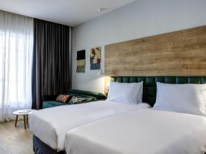 Krevet ili kreveti u jedinici u okviru objekta Tarcin Forest Resort & Spa Sarajevo - MGallery Collection +135 fotografija