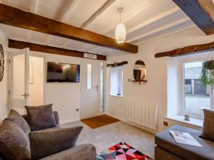 a living room with a couch and a window at 3 Bed in Arnside and Silverdale 90531 in Beetham