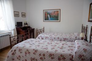 A bed or beds in a room at Le Vigne di Clementina Fabi