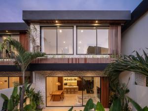 an external view of a house with a balcony at La Finca Bingin in Uluwatu