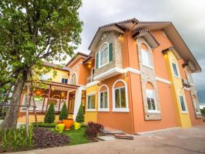 a home with an orange and yellow house at Eitanic Resort in Ban Don Tako