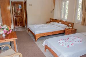 Postel nebo postele na pokoji v ubytování Metin Hotel