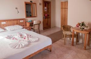 Postel nebo postele na pokoji v ubytování Metin Hotel