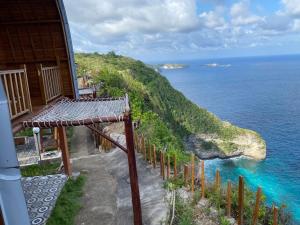 a view of the ocean from a house at Suwehan Beach Cliff House with Hammock in Polilit +54 photos