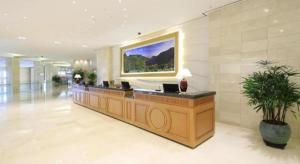 a lobby with a large painting on the wall at Jeju Booyoung Hotel in Seogwipo +68 photos